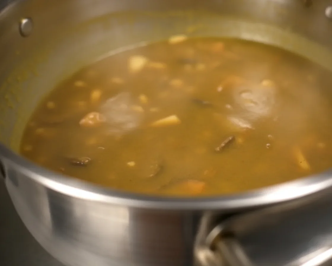 Delicious Puha Recipes for a Wholesome Home-Cooked Meal 1 A colorful bowl of spiced flattened rice poha with vegetables and peanuts.